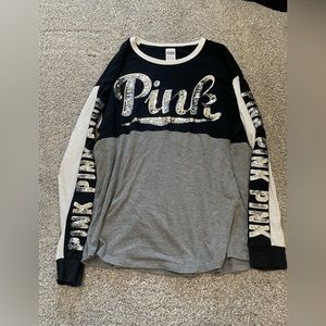 Pink long sleeve top.